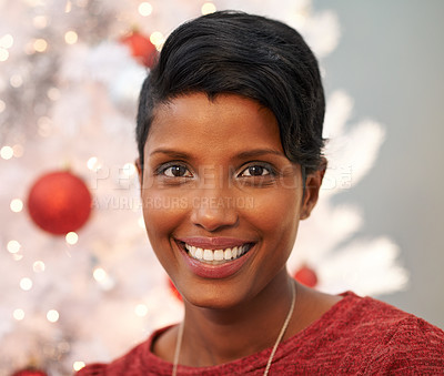 Buy stock photo Smile, christmas and portrait of woman at her home for festive event, party or celebration. Happy, holidays and face of female person from Colombia with xmas tree on sofa in living room at apartment.