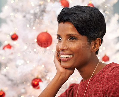 Buy stock photo Woman, thinking and smile by Christmas tree in home, lounge and excited for festive season. Black female person, religious holiday and ready for celebration in living room, happiness and tradition