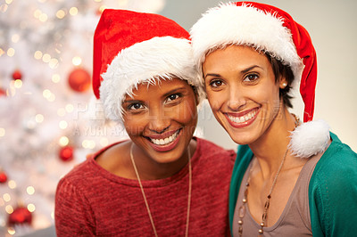 Buy stock photo Friends, hat and portrait by Christmas tree in home, smile and excited for festive season. Women, religious holiday and ready for celebration in living room, happy and traditional fashion on vacation
