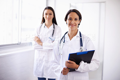 Buy stock photo Portrait of a pair of confident young doctors