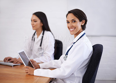 Buy stock photo Portrait, doctor and happy woman with tablet in hospital for healthcare, wellness or coworking online. Face, smile or medical professional with technology at desk, employee or expert team in clinic