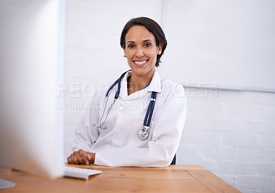 Buy stock photo Portrait, doctor and happy woman at desk in hospital for healthcare, wellness or working online on computer. Face, smile or medical expert at table, professional or employee with confidence in clinic