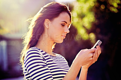 Buy stock photo Outdoor, sunshine and woman with smartphone, typing and internet with social media or website info. Cellphone, girl in a city or mobile user with digital app or tech with online reading, blog or news