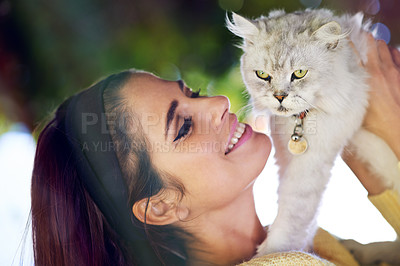 Buy stock photo Woman, cat and hug outdoors for love, pet care and smile for affection in garden or park. Female person, animal and embrace for bonding on vacation or holiday, happy and companion for support or joy