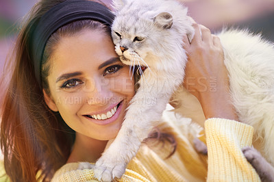 Buy stock photo Woman, cat and holding outdoors in portrait, pet care and smile for affection outside. Female person, animal and embrace for bonding on vacation or holiday, happy and companion for support or joy