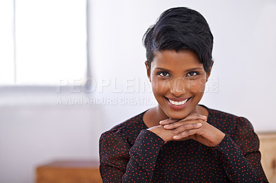 Buy stock photo A portrait of a beautiful young woman sitting in an office