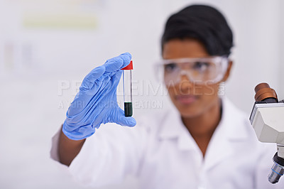 Buy stock photo Blood, hand and scientist with test tube in laboratory for scientific research or experiment. Microscope, science and woman researcher with pharmaceutical dna in glass vial for medical study.