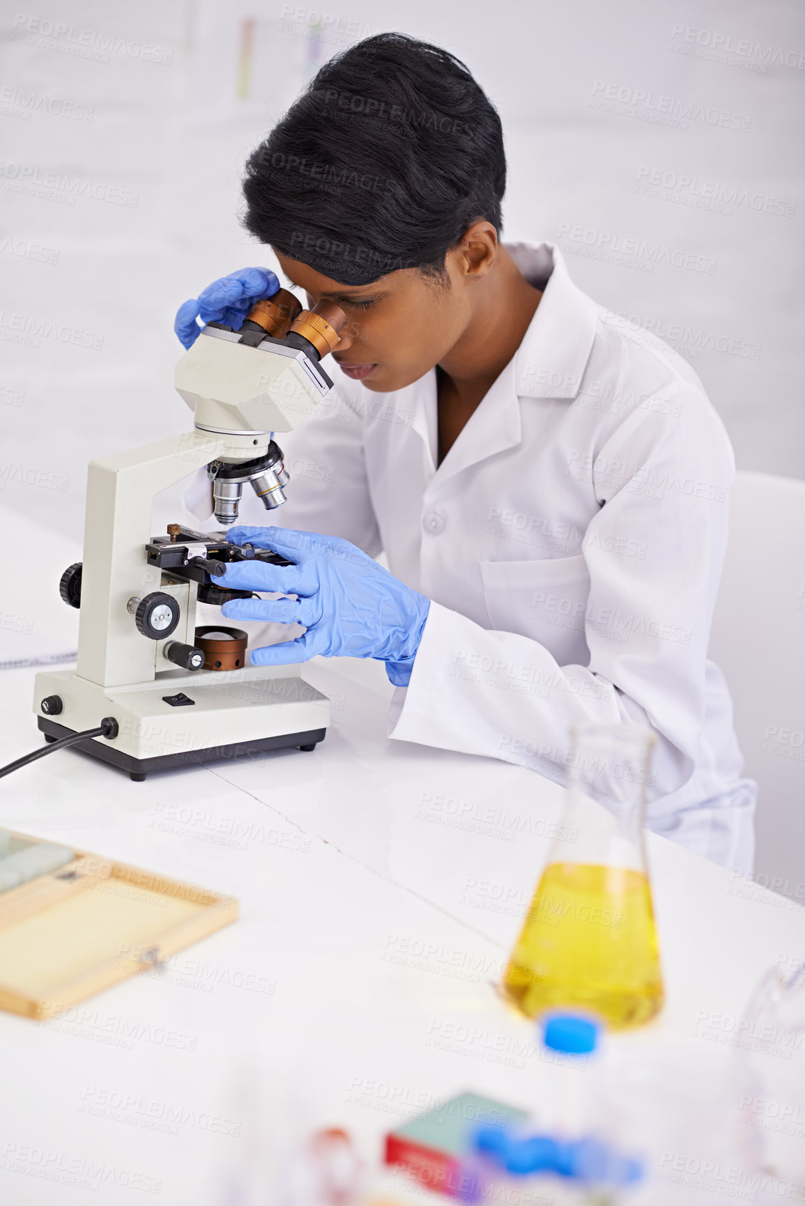Buy stock photo Doctor, microscope and scientist in laboratory for equipment, experiment and innovation. Science, technology and researcher or woman with medical research for sample analysis and bacteria testing