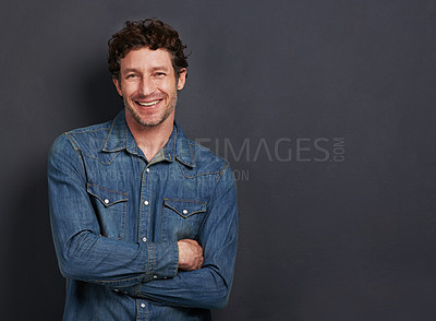 Buy stock photo Studio, portrait and man with confidence, casual fashion and mockup space for creative professional. Relax, happy and face of person with smile, pride and trendy denim style on dark grey background