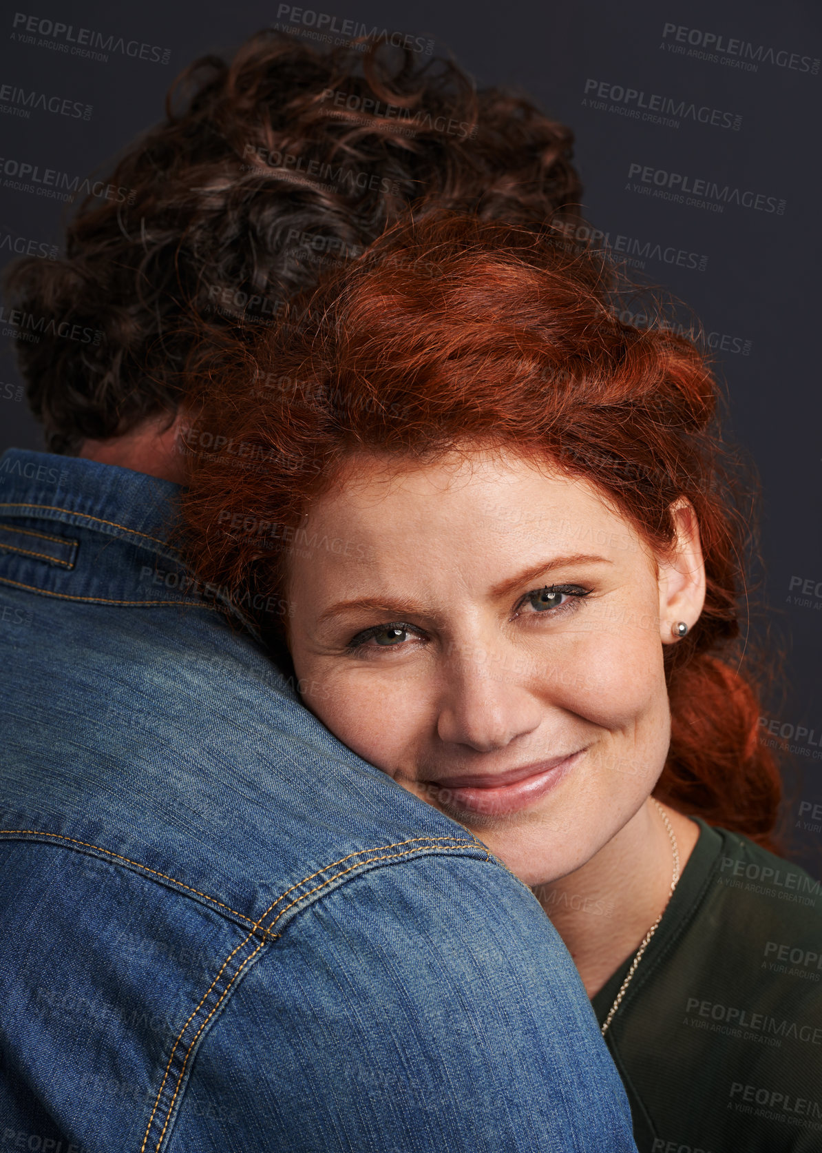 Buy stock photo Portrait of a beautiful young woman resting her head on her boyfriend's shoulder