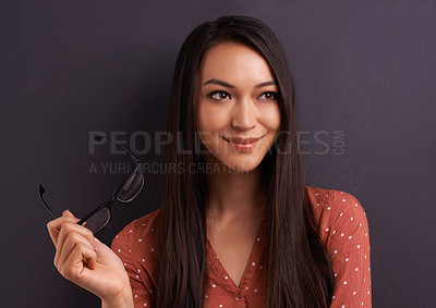 Buy stock photo A pretty young woman looking at the camera