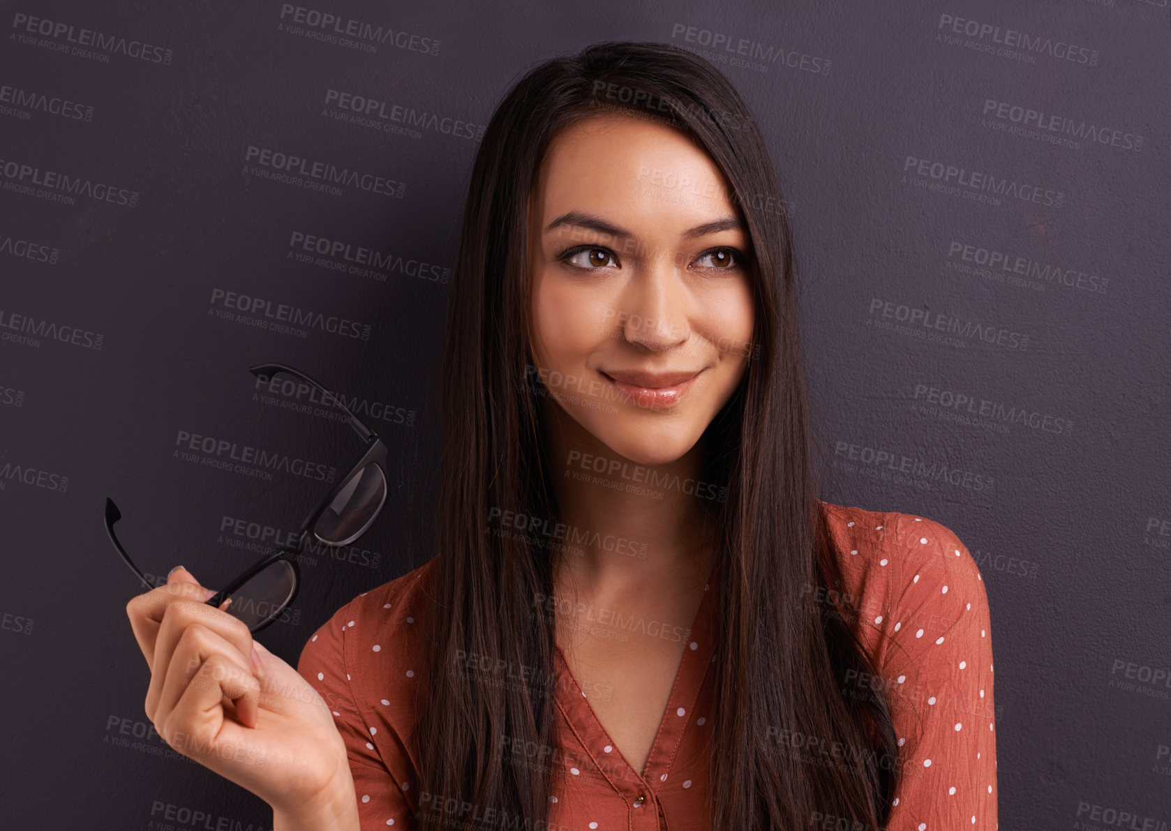 Buy stock photo A pretty young woman looking at the camera