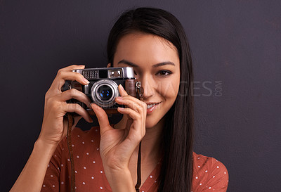 Buy stock photo Woman, portrait and film camera for photography in studio for vintage creativity, grey background or mockup space. Female person, face and equipment for picture career or memory fun, lens or photo