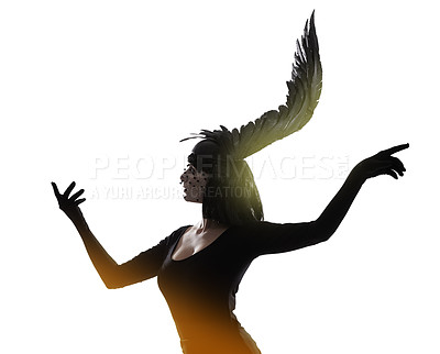 Buy stock photo Shot of a young woman in a wing-shaped headpiece standing in a studio