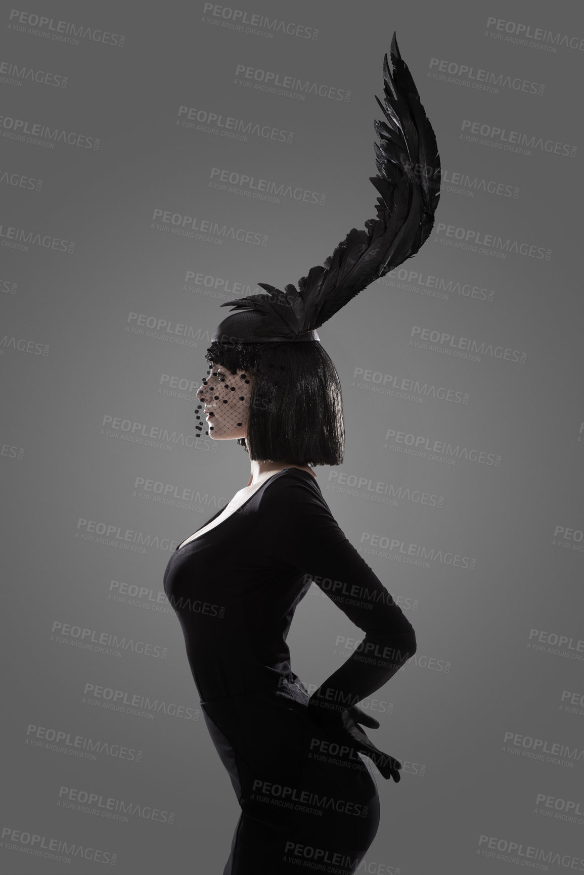 Buy stock photo A young woman styled with a feather hat