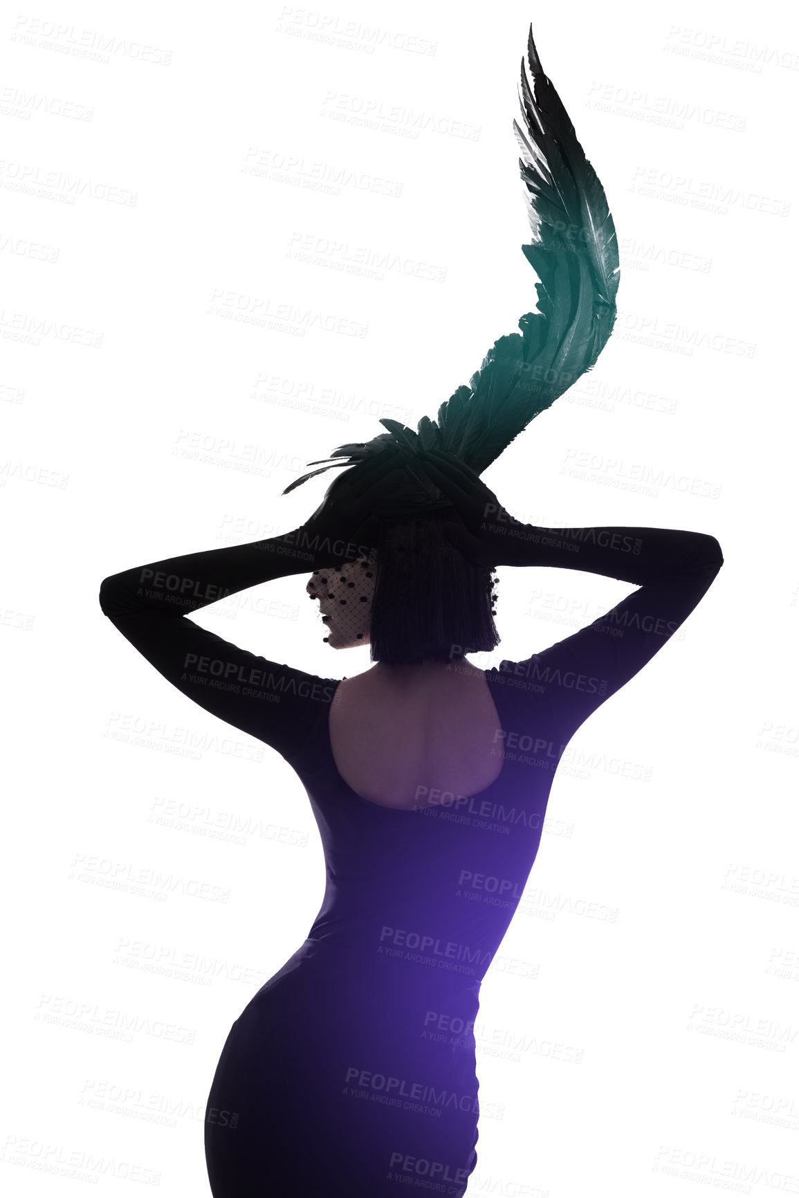 Buy stock photo Rear view shot of a young woman wearing a wing-shaped headpiece