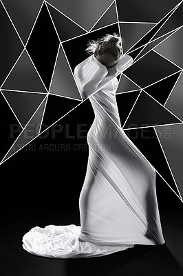 Buy stock photo Studio shot of a woman wrapped in fabric and surrounded by geometric shapes against a black background