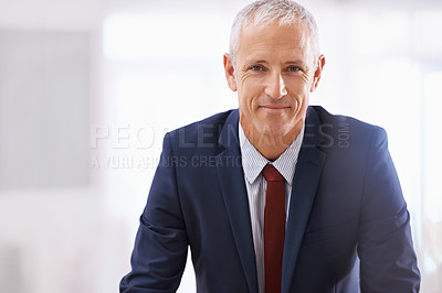 Buy stock photo Shot of a mature businessman looking confident