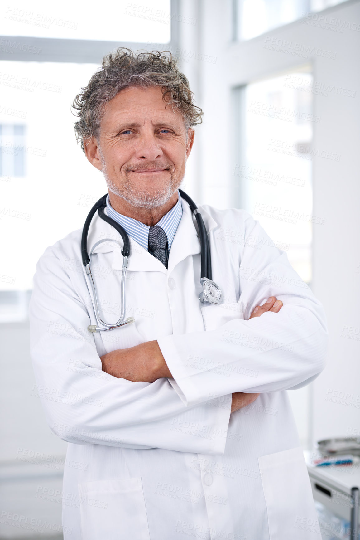 Buy stock photo Senior man, doctor and portrait with arms crossed in office for healthcare, medical support and medicine career. Mature, face and health expert with smile or confidence with stethoscope in hospital