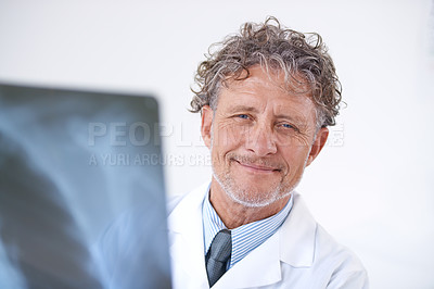 Buy stock photo Senior man, doctor and portrait with xray for healthcare, injury analysis or anatomy with radiology and smile. Mature, face or health expert or happy for diagnosis or confidence for results in clinic