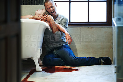 Buy stock photo Shot of a distraught man embracing a woman with a slit wrist in a bathtub