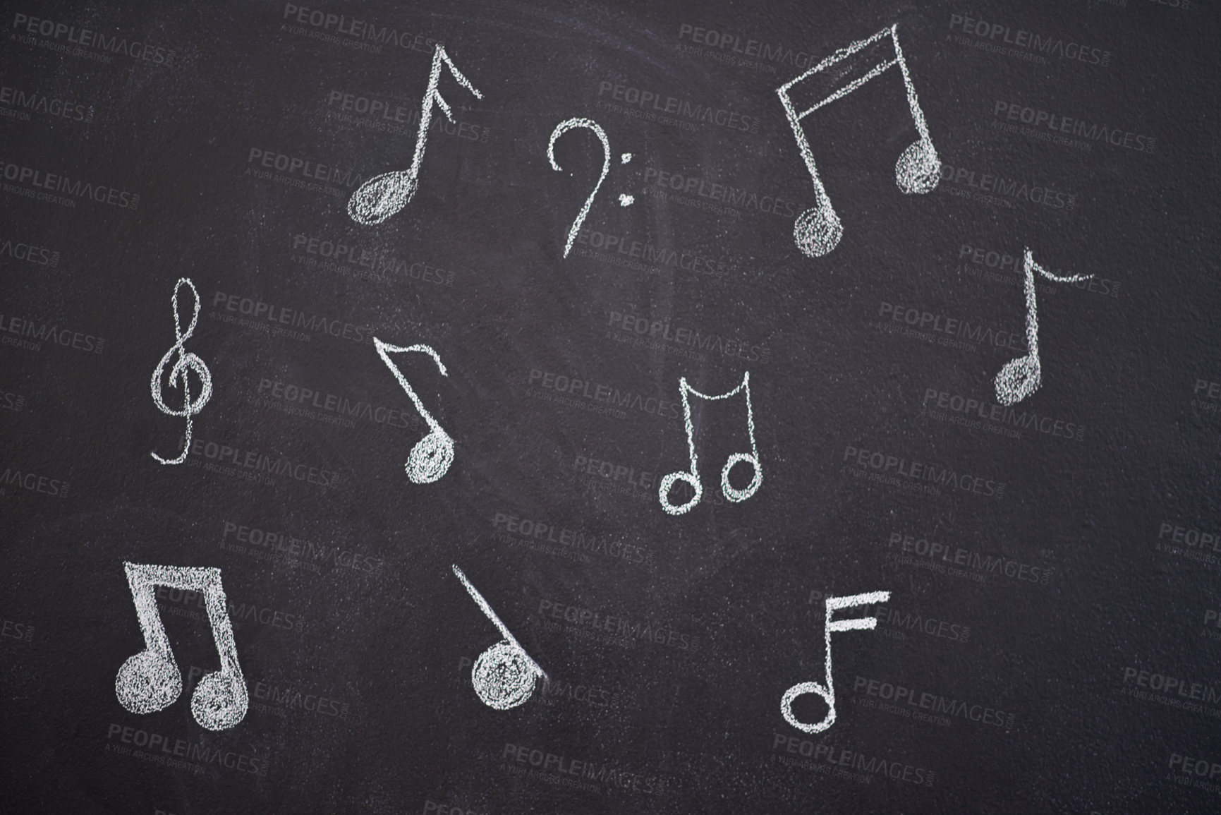 Buy stock photo Shot of various musical notes drawn onto a chalk board