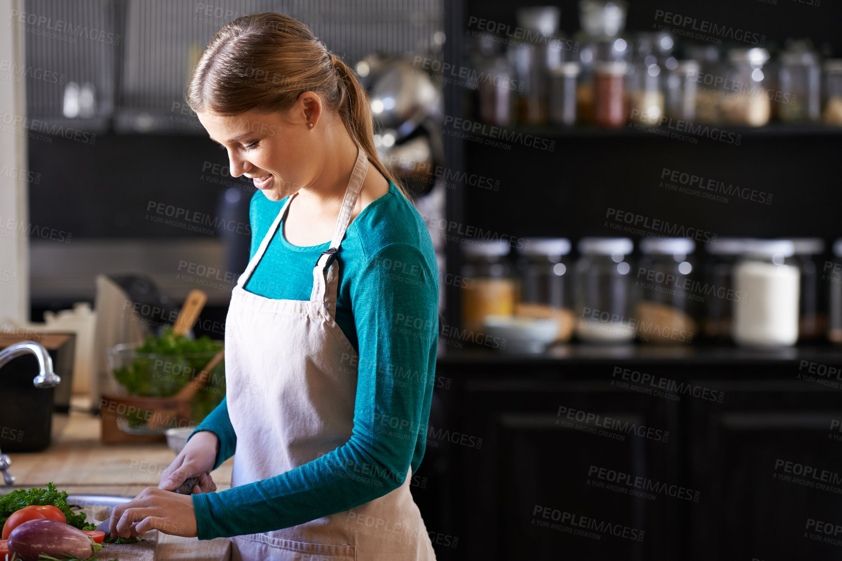 Buy stock photo Chef, cooking and woman with vegetables in kitchen cutting ingredients with knife at home. Happy, groceries and female person with organic produce for organic dinner, supper or meal at apartment.