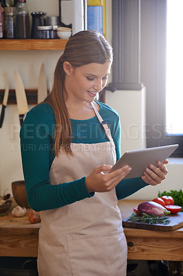 Buy stock photo Woman, cooking and online tablet with vegetables for healthy diet recipe, nutrition or kitchen. Female person, chef and apron with technology for vegetarian meal or ingredients, lunch or browsing