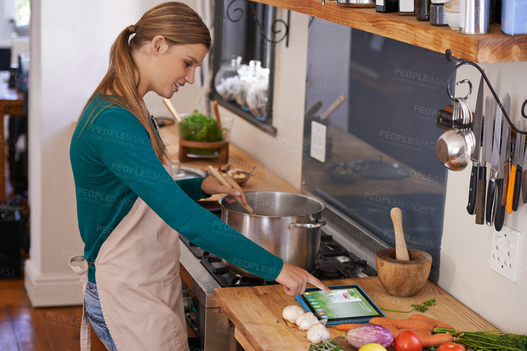 Buy stock photo Woman, cooking and tablet with vegetables in kitchen as nutrition meal or online recipe, diet or connectivity. Female person, home and raw ingredients with internet or vegan eating, prepare or hungry