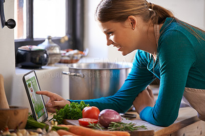 Buy stock photo Woman, cooking and tablet with vegetables as recipe nutrition meal on kitchen counter, diet or connectivity. Female person, home and raw ingredients with internet or vegan eating, prepare or hungry