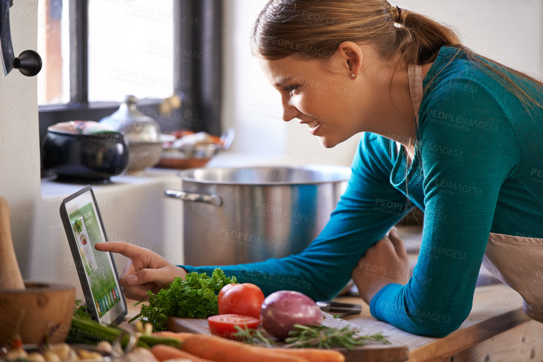 Buy stock photo Woman, cooking and tablet with vegetables as recipe nutrition meal on kitchen counter, diet or connectivity. Female person, home and raw ingredients with internet or vegan eating, prepare or hungry