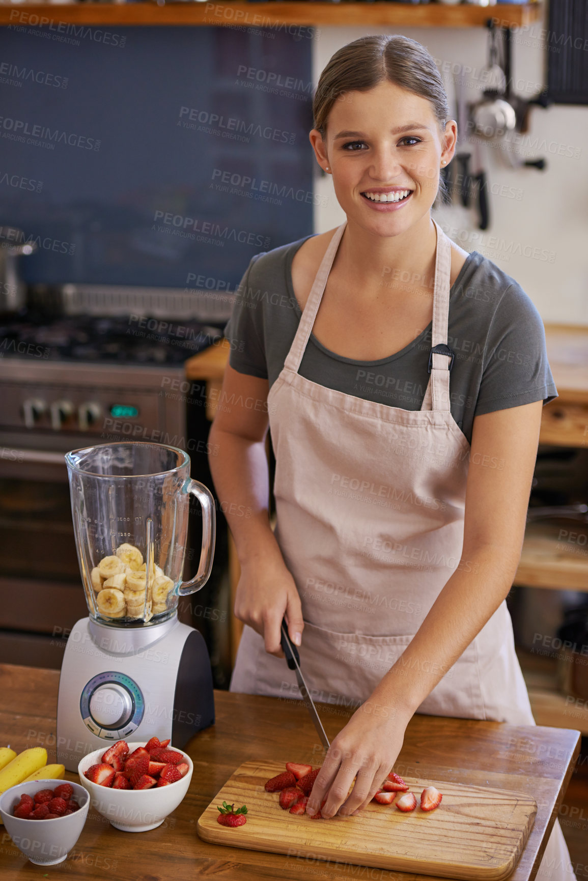 Buy stock photo Woman, portrait and fruit smoothie in kitchen for weight loss nutrition, healthy or vitamins. Female person, face and knife with cutting board for juicer shake or blender, ingredients or preparation