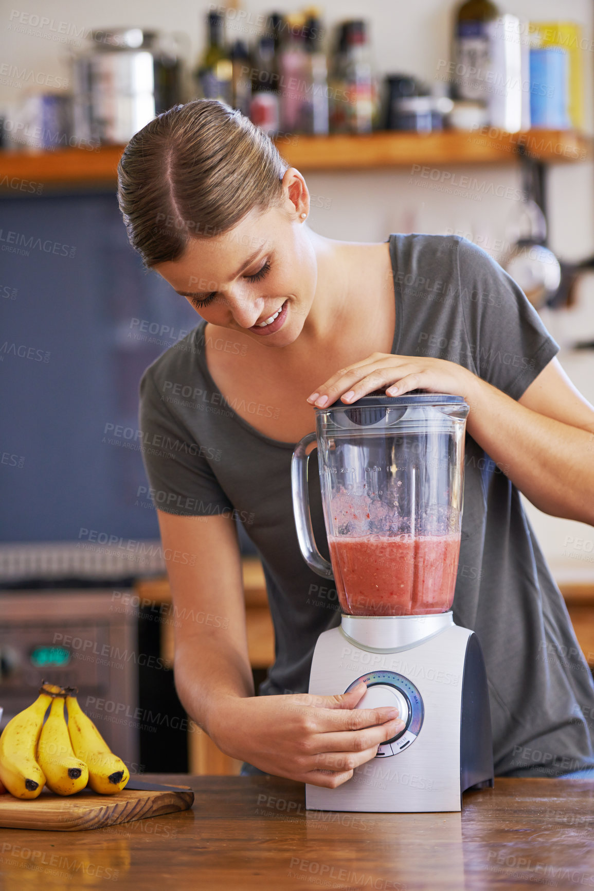 Buy stock photo Kitchen, smile and woman on blender for smoothie, nutrition or food for healthy diet at table in home, Happy person, fruit and mixer for drink, juice or ingredients for wellness with organic beverage