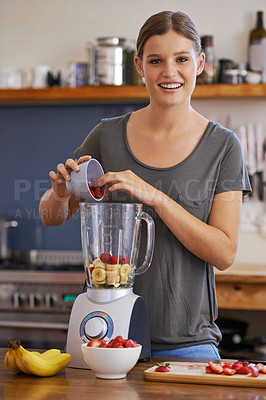 Buy stock photo Portrait, smile and woman on blender for smoothie, nutrition or food for healthy diet at table in home kitchen. Happy person, face and fruit mixer with strawberry for wellness and organic banana