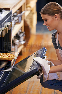 Buy stock photo Bakery, oven and woman with a pie in kitchen and cooking as a chef at restaurant or cafe. Person, smile and baker prepare food in catering business with dinner or lunch and skill of baking pastry