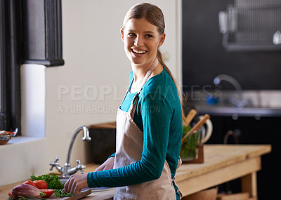 Buy stock photo Happy, cooking and woman with vegetables in kitchen cutting ingredients with knife at home. Smile, groceries and young female person with produce for dinner, supper or meal at modern apartment.
