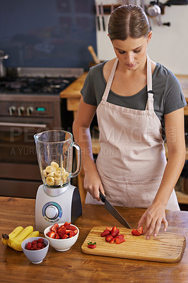 Buy stock photo Woman, fruit and blender for healthy smoothie in kitchen for weight loss nutrition, chopping board or ingredients. Female person, knife and preparation for vegan snack in apartment, organic or detox