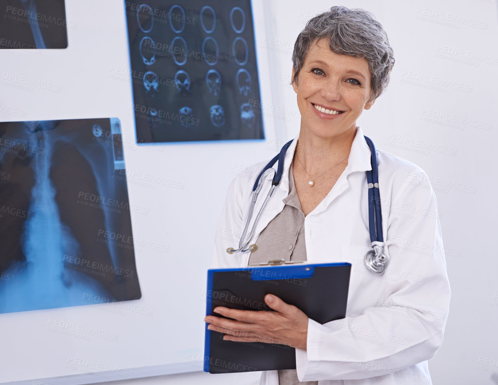 Buy stock photo Doctor, woman and portrait with clipboard, radiology for surgery with anatomy scan and healthcare. Senior medical professional, treatment and surgeon in room for xray, checklist and confident expert