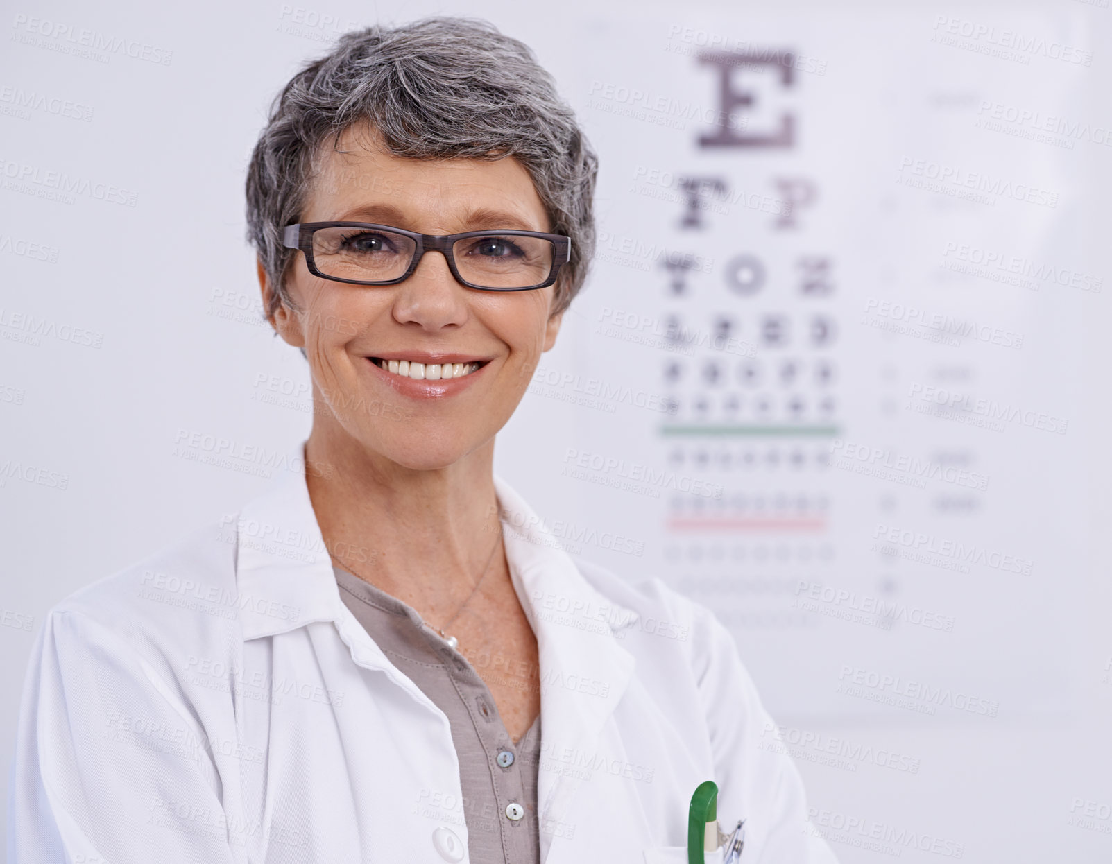 Buy stock photo Portrait, senior woman and optometrist smile for eye care, letter chart for exam with doctor at clinic. Alphabet, glasses for vision and prescription lens, assessment and ophthalmology for spectacles