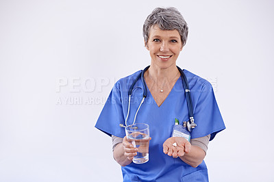 Buy stock photo Mature woman, doctor and water with pills, healthcare with medication treatment and supplements on white background. Vitamins, medicine and pharmaceutical drugs with physician for health in studio