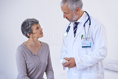 Buy stock photo Hospital, consulting and doctor with pills for patient for prescription, medicine and treatment. Healthcare, medication and senior woman in consultation for medical service, wellness and diagnosis