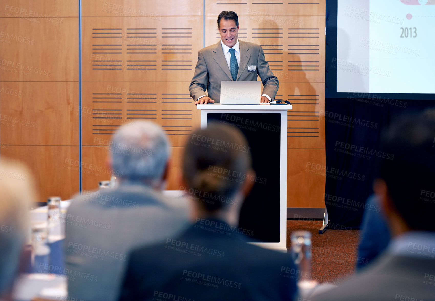 Buy stock photo A confident businessman giving a presentation at a press conference