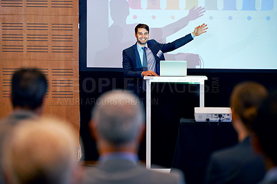 Buy stock photo Business man, podium and presentation, pointing at projector screen at conference or workshop with laptop for PPT. Corporate training, seminar and speaker with info, audience and professional speech