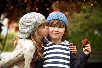 Buy stock photo Children, love and siblings kiss in a park for travel, adventure or bonding on autumn journey in nature. Family, support and kids hug in a forest for explore, playing or fun games in Canada outdoor