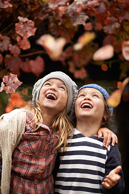 Buy stock photo Happy, celebration and children with autumn leaves, freedom or fun in a park for bonding, games or playing. Nature, love and kids excited for tree confetti in woods for camping, learning or travel