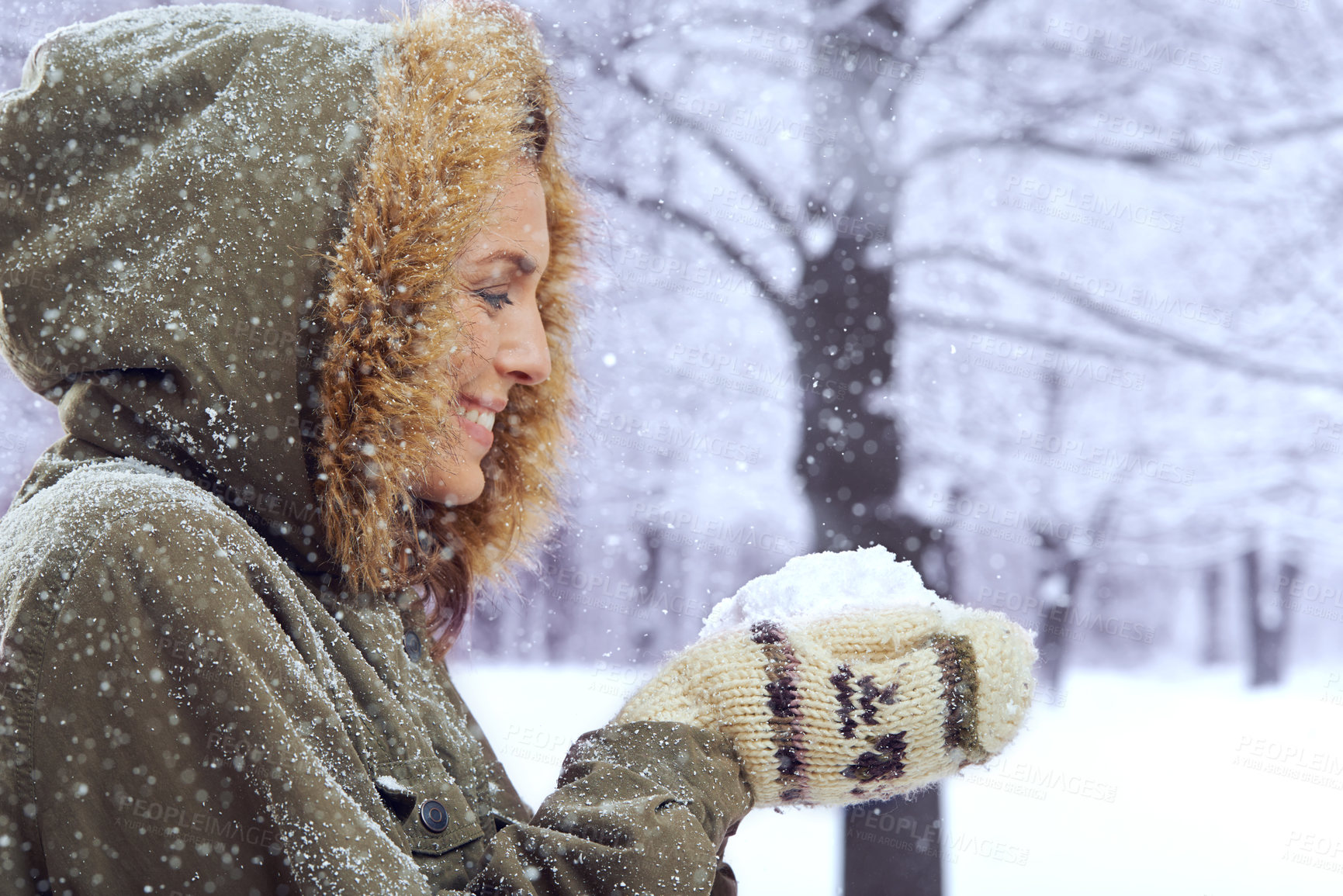Buy stock photo Shot of an attractive woman standing outside in the snow