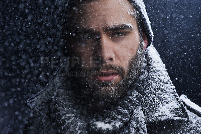Buy stock photo Snow, night and man with serious portrait outdoor in winter with storm, ice and travel with cold climate. Cool, frost and male person in Iceland with adventure and freezing from weather in nature