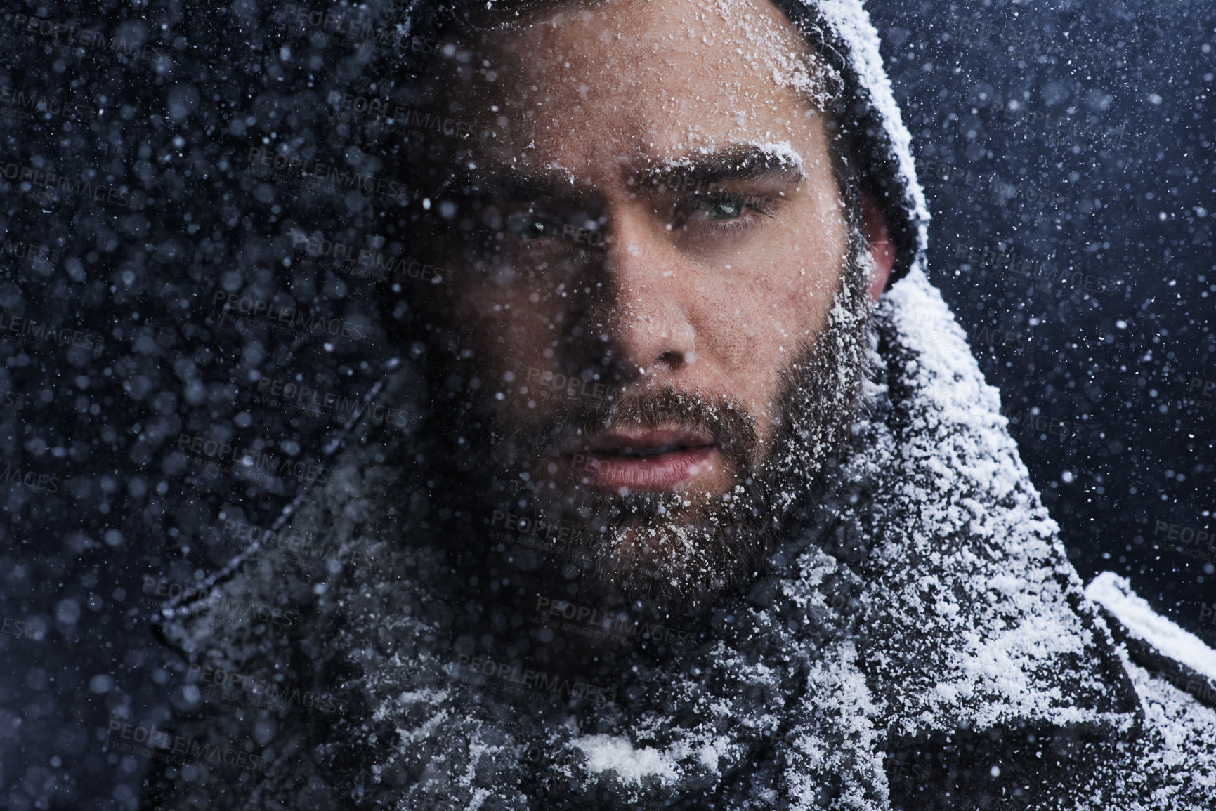 Buy stock photo Snow, night and man with serious portrait outdoor in winter with storm, ice and travel with cold climate. Cool, frost and male person in Iceland with adventure and freezing from weather in nature