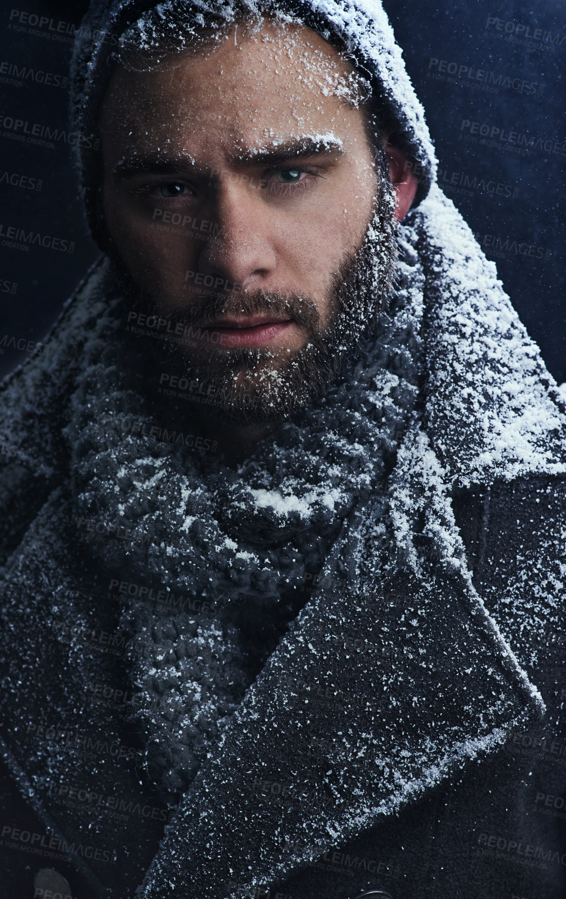 Buy stock photo Cropped shot of a handsome young man covered in snow