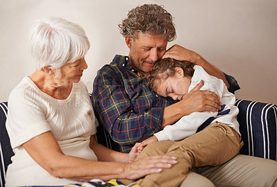 Buy stock photo Grandparents, child and home on sofa for comfort, family support with love for kid. Sleep, children development and elderly people together or hug in living room, calm and peace with senior couple